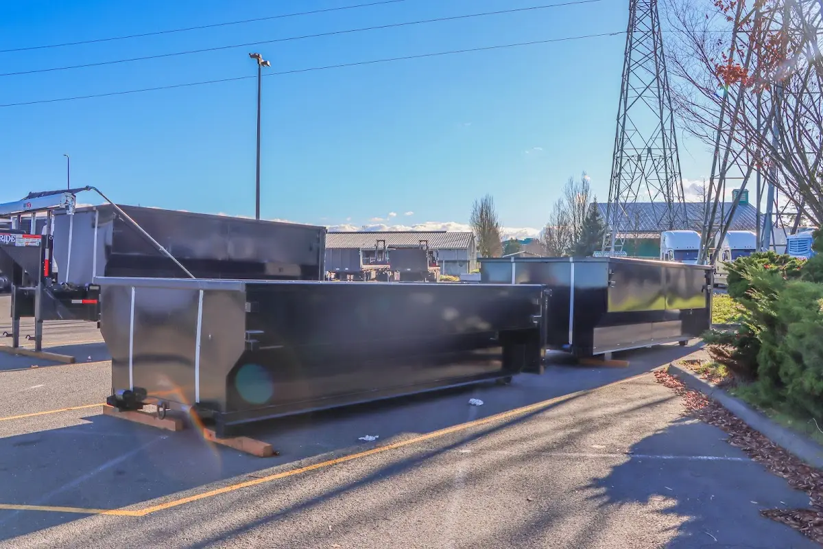 Roll-off dumpster ready for waste disposal at job site for 15 Yard Dumpster Rental in Lovejoy